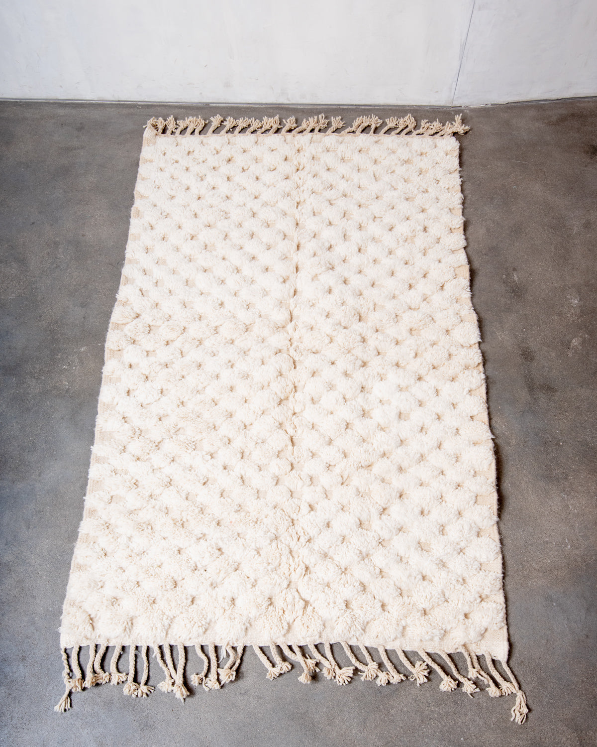 Modern, designer, handcrafted Berber rug from Morocco. Beniourain carpet with minimalist design, natural wool pile and a fluffy texture.
